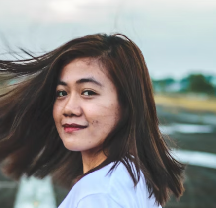 Woman with windblown hair.